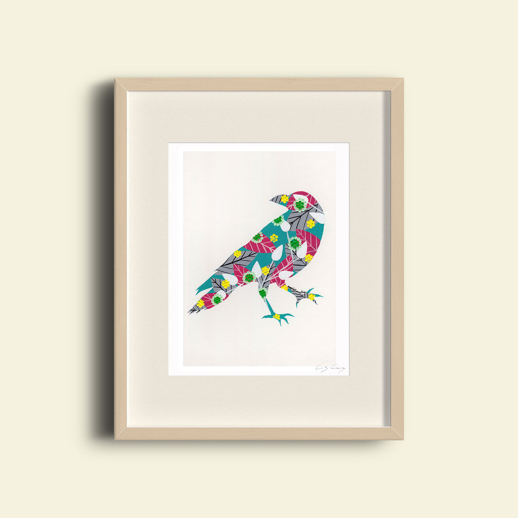 A framed fine art print, by Lis Gonçalves. Open edition, signed by the artist (printed in Hahnemühle matt fibre paper) featuring a colorful raven on a beige background