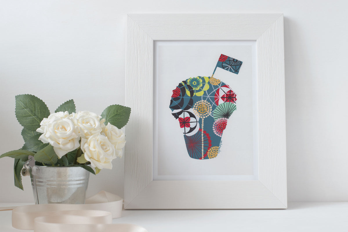 A framed fine art print, by Lis Gonçalves. Open edition, signed by the artist (printed in Hahnemühle matt fibre paper) featuring a colorful manjerico design on a white surface with flowers and candles.