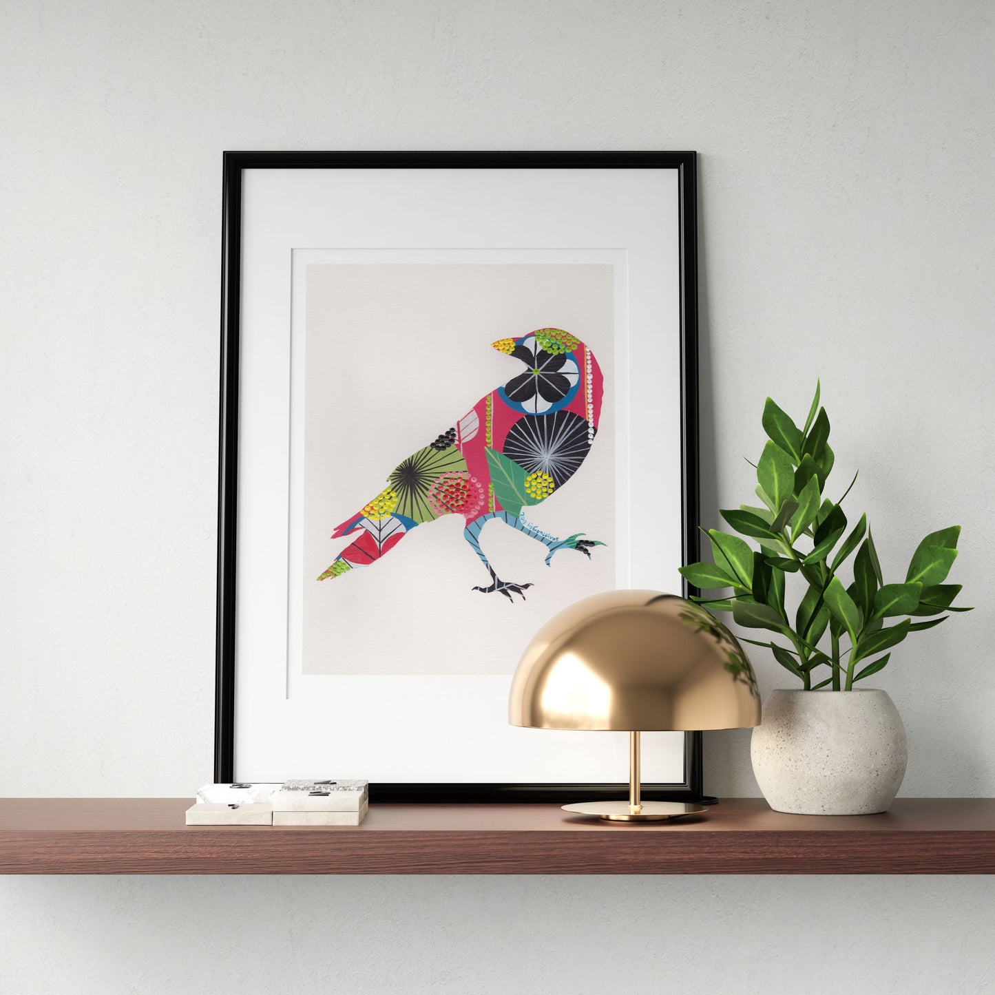 A framed fine art print, by Lis Gonçalves. Open edition, signed by the artist (printed in Hahnemühle matt fibre paper) featuring a colorful bird on a wooden shelf with a gold lamp and plant.