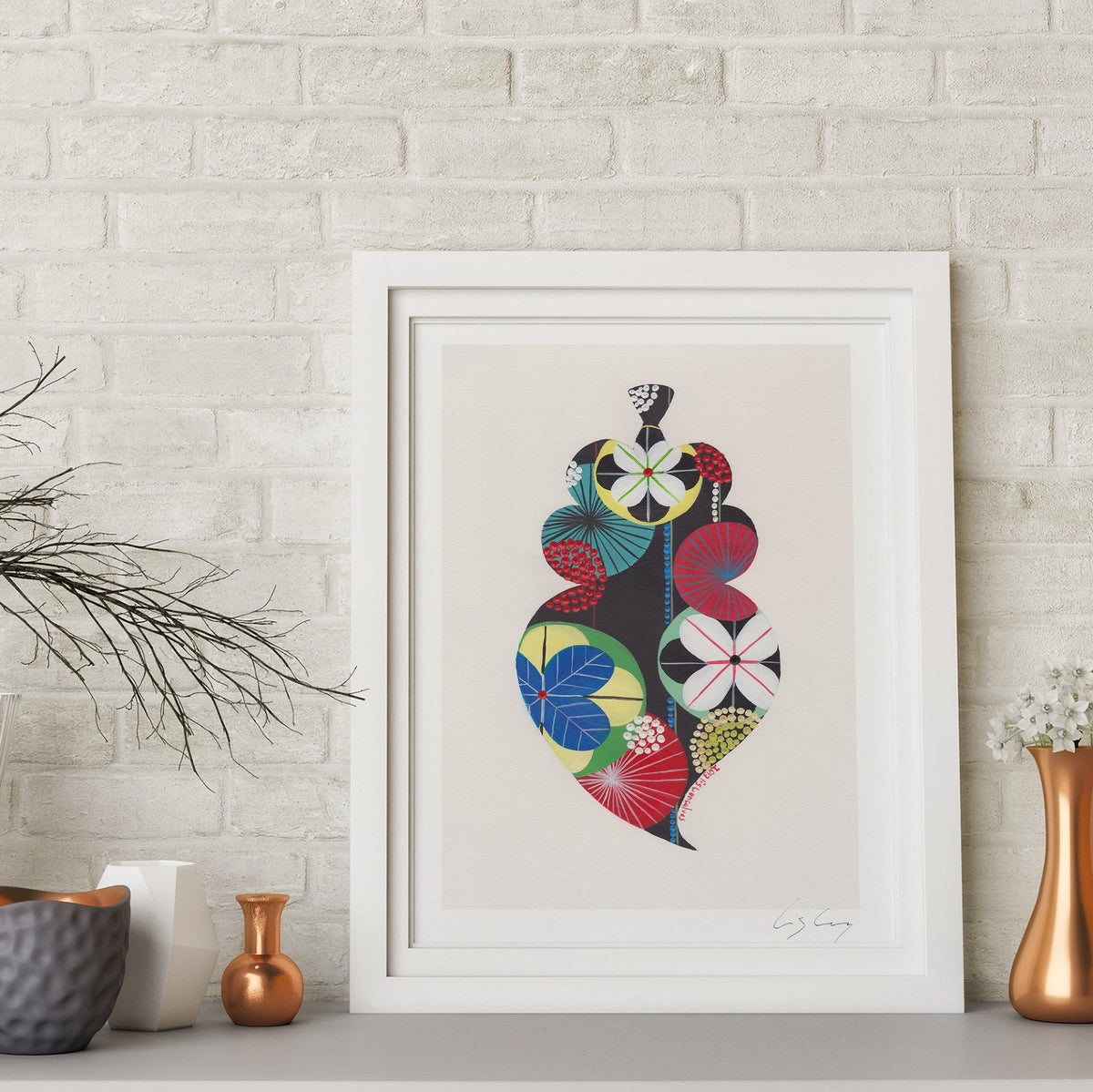 A framed fine art print, by Lis Gonçalves. Open edition, signed by the artist (printed in Hahnemühle matt fibre paper) featuring a colorful Portuguese Viana heart on a wall with decorative vases and plants.