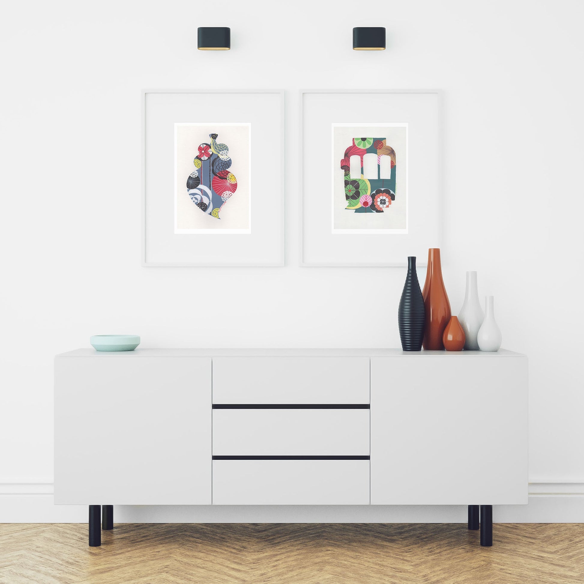 Two framed fine art prints, by Lis Gonçalves. Open edition, signed by the artist (printed in Hahnemühle matt fibre paper) featuring a colorful Portuguese Viana heart and a Lisbon tram over a white cabinet with decorative items.