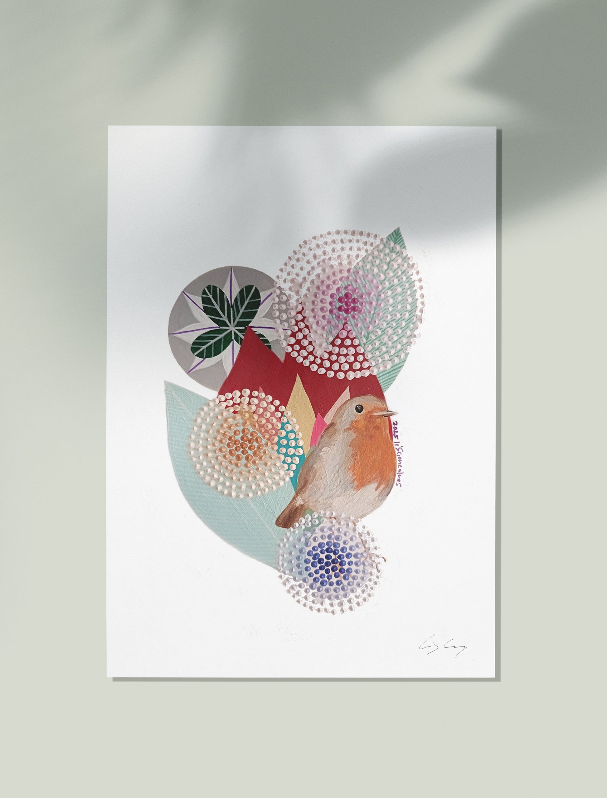 An unframed fine art print, by Lis Gonçalves. Open edition, signed by the artist. Printed in Hahnemühle matt fibre paper; featuring a stylized robin bird and abstract circular floral motifs in muted red, teal, pink, and blue on a white background, displayed against a pale green wall with soft shadows.