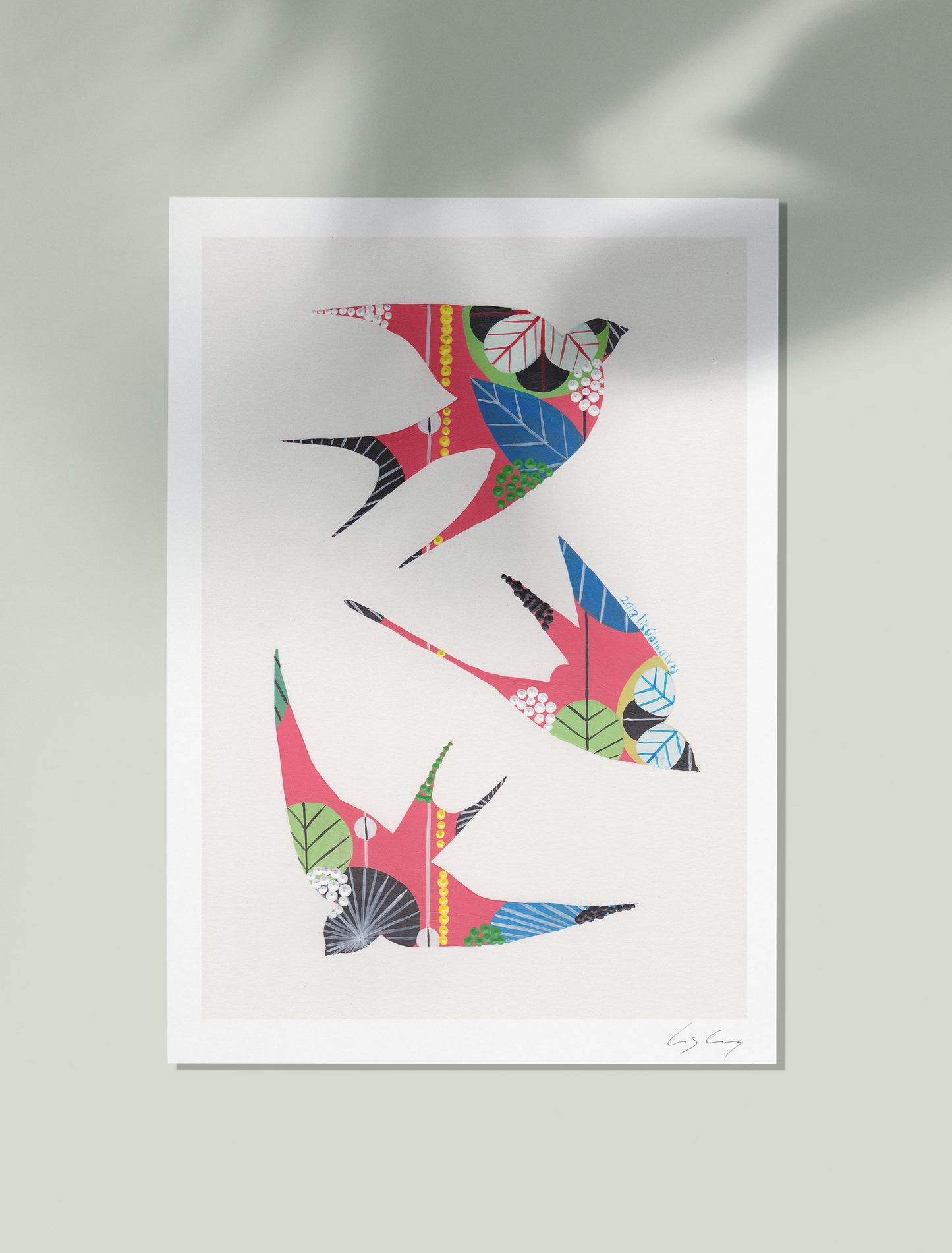 An unframed fine art print, by Lis Gonçalves. Open edition, signed by the artist (printed in Hahnemühle matt fibre paper) featuring colorful swallows on a white background