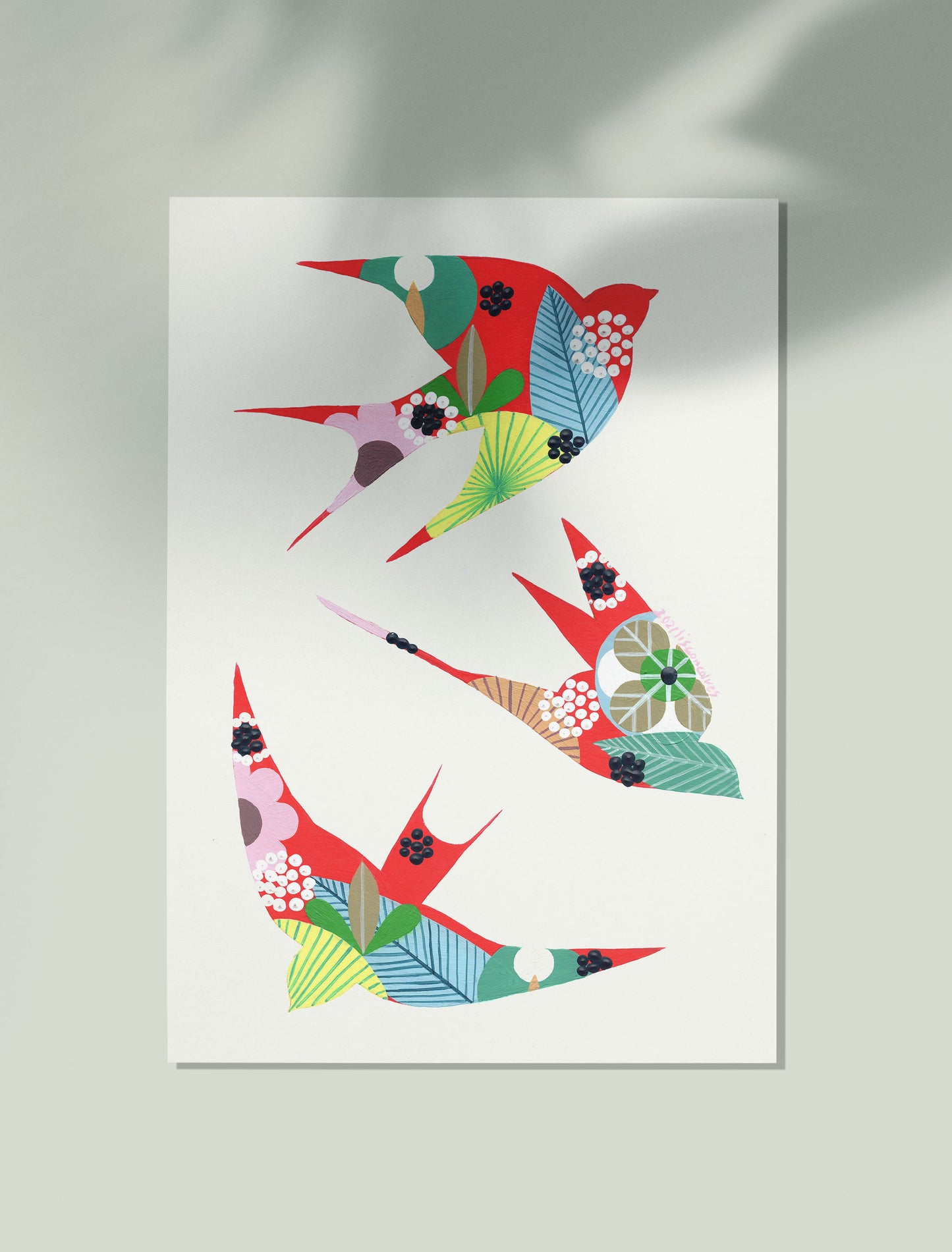 An unframed original artwork, by Lis Gonçalves. Painted in acrylic on paper, featuring colorful swallows in a Japanese-inspired patterned design, displayed against a light gray wall with soft shadow overlays.
