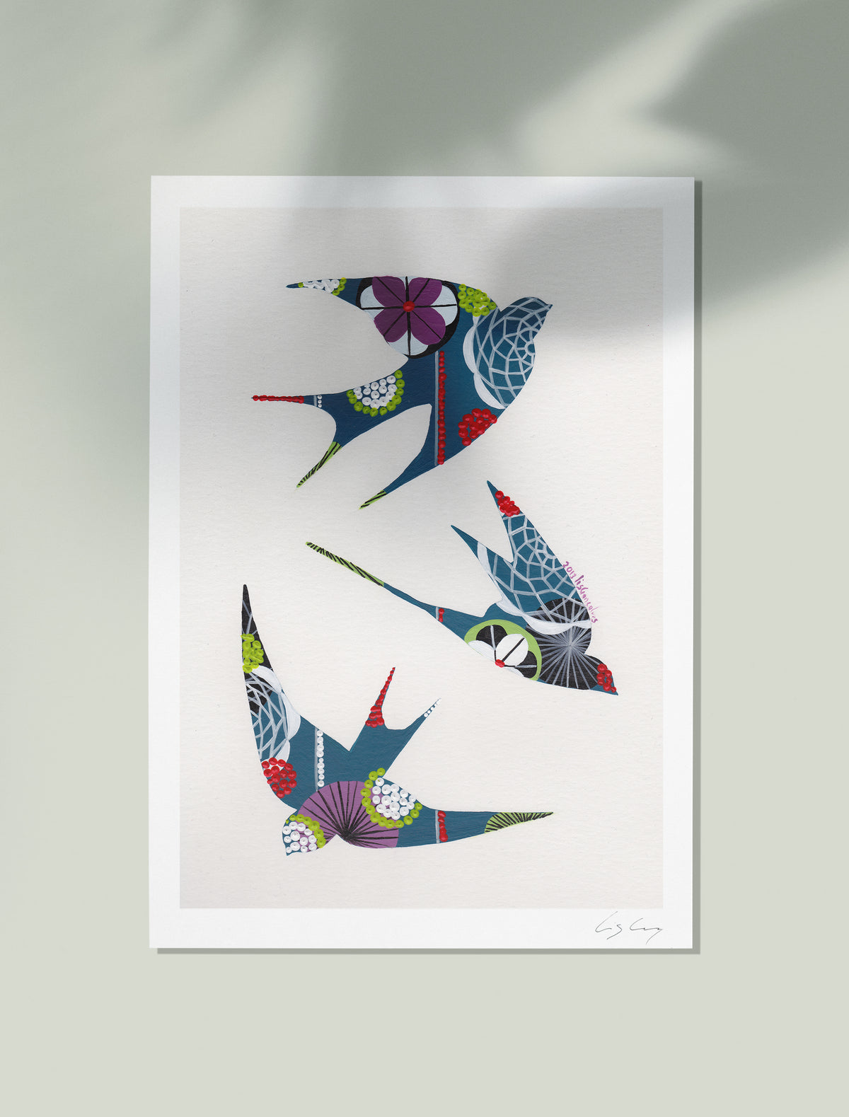 An unframed fine art print, by Lis Gonçalves. Open edition, signed by the artist (printed in Hahnemühle matt fibre paper) featuring colorful swallows on a white background