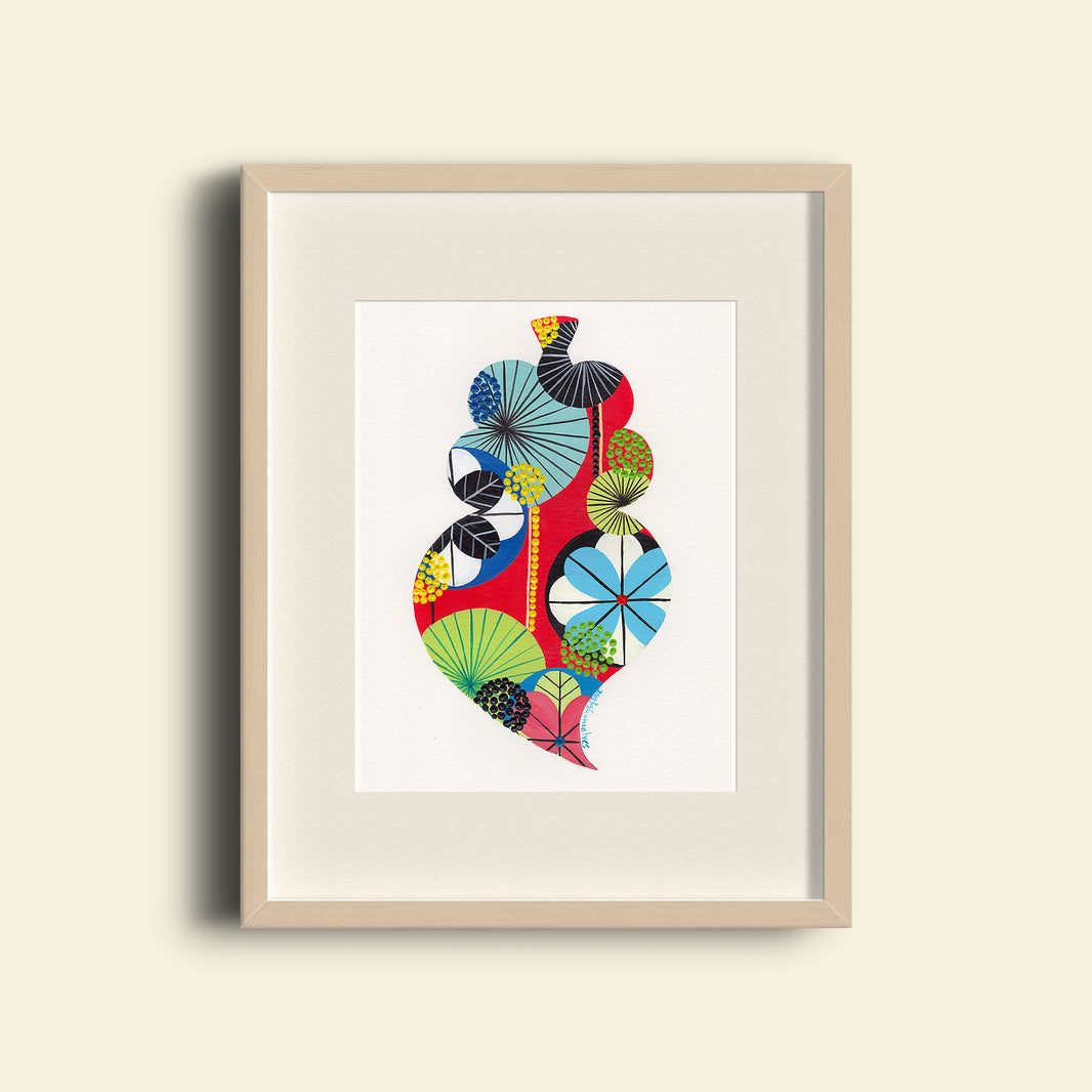 A framed fine art print, by Lis Gonçalves. Open edition, signed by the artist (printed in Hahnemühle matt fibre paper) featuring a colorful Portuguese "Viana" heart on a beige wall