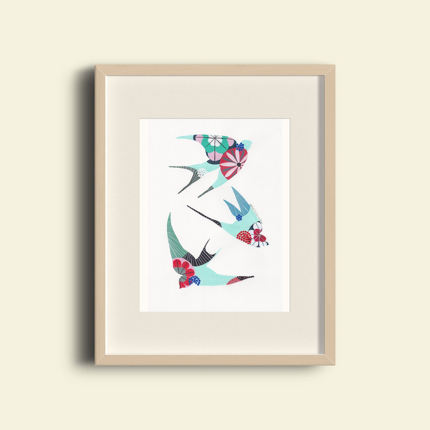 A framed fine art print, by Lis Gonçalves. Open edition, signed by the artist (printed in Hahnemühle matt fibre paper) featuring colorful swallows on a white background