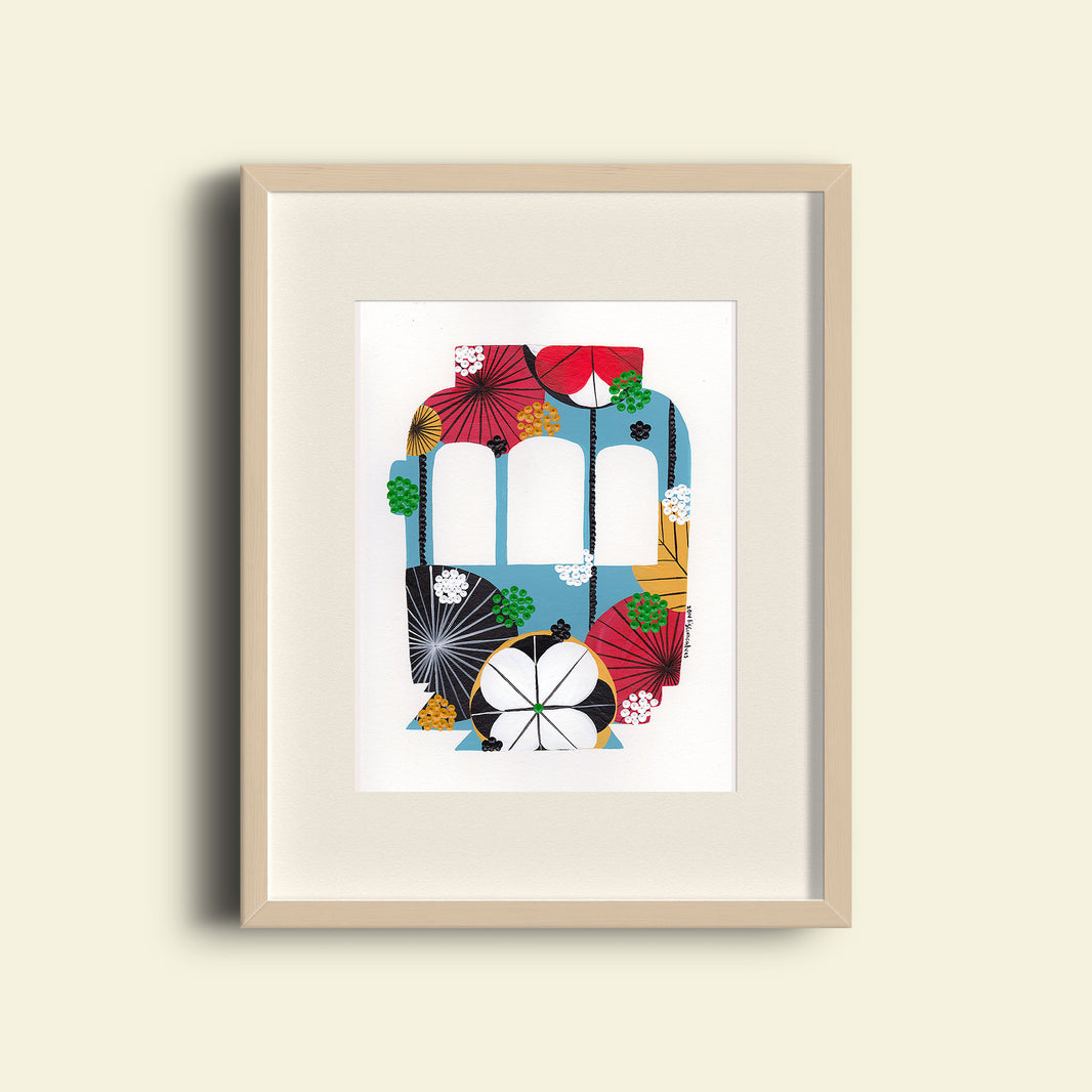 A framed fine art print, by Lis Gonçalves. Open edition, signed by the artist (printed in Hahnemühle matt fibre paper) featuring a colorful Lisbon tram on a beige background.