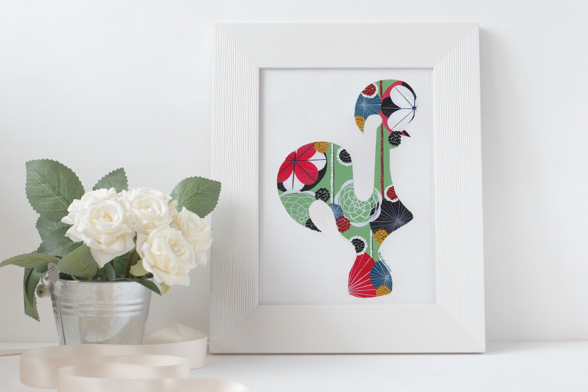 A framed fine art print, by Lis Gonçalves. Open edition, signed by the artist (printed in Hahnemühle matt fibre paper) featuring a colorful Portuguese rooster on a white surface with flowers.
